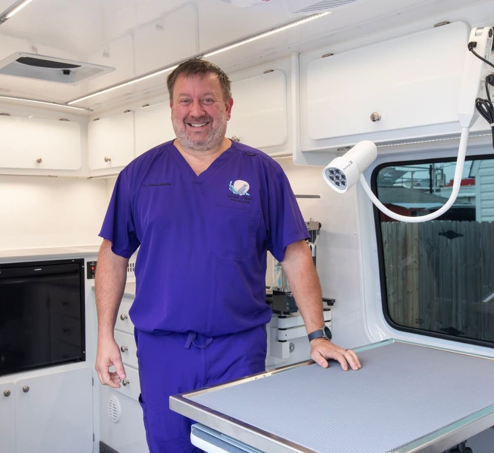 Smiling vet in clinic truck
